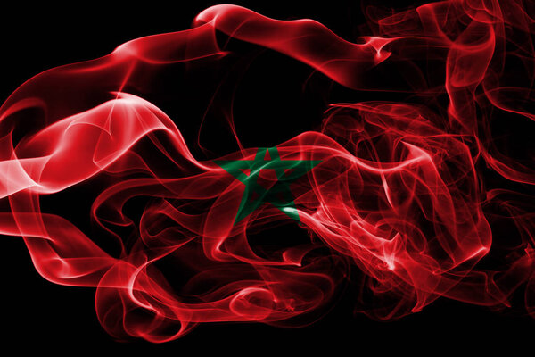 National flag of Morocco made from colored smoke isolated on black background. Abstract silky wave background.