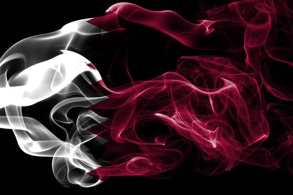 National flag of Qatar made from colored smoke isolated on black background. Abstract silky wave background.