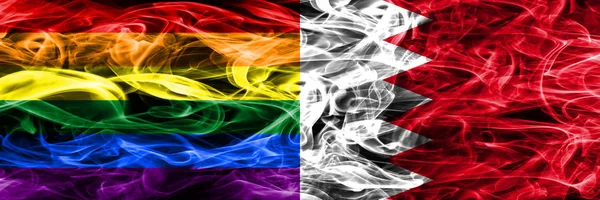 同性恋 巴林烟旗并排放置 同性恋和巴林厚颜色的丝绸烟雾旗 — 图库照片