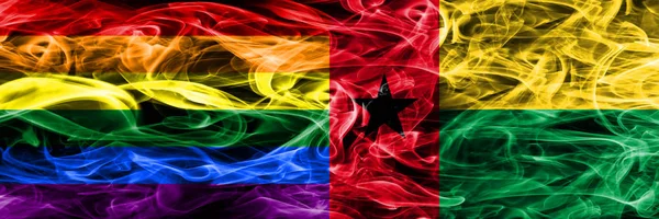 同性恋与几内亚比绍的烟旗并排放置 同性恋和几内亚比绍的厚颜色的丝质烟雾旗 — 图库照片