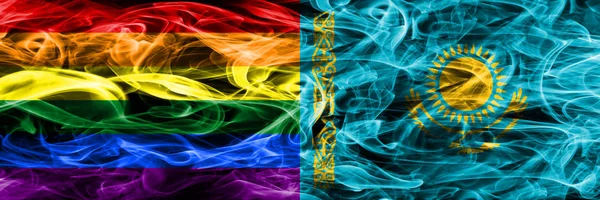 Gay vs Kazakhstan smoke flags placed side by side. Thick colored silky smoke flags of Gay and Kazakhstan