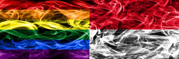 同性恋 摩纳哥的烟雾旗并排放置 同性恋和摩纳哥厚颜色的丝绸烟雾旗 — 图库照片