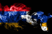 Nemzeti zászló, a Artsakh készült színes füst elszigetelt fekete háttér. Háttér absztrakt selymes hullám.