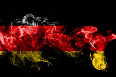 Almanya'nın ulusal bayrak renkli duman siyah arka plan üzerine izole yapılmış. Soyut ipeksi dalga arka plan.