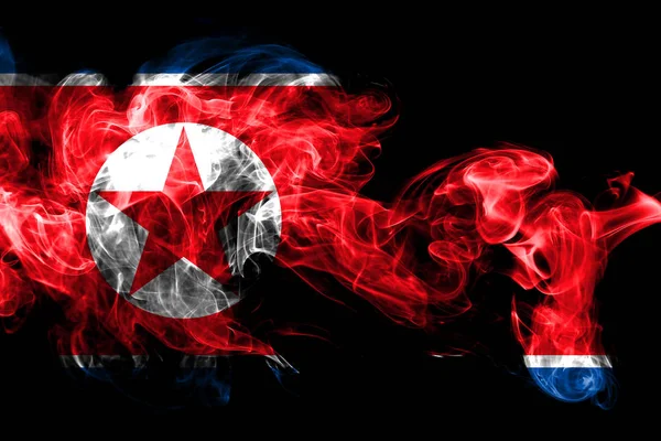 National flag of North Korea made from colored smoke isolated on black background. Abstract silky wave background.
