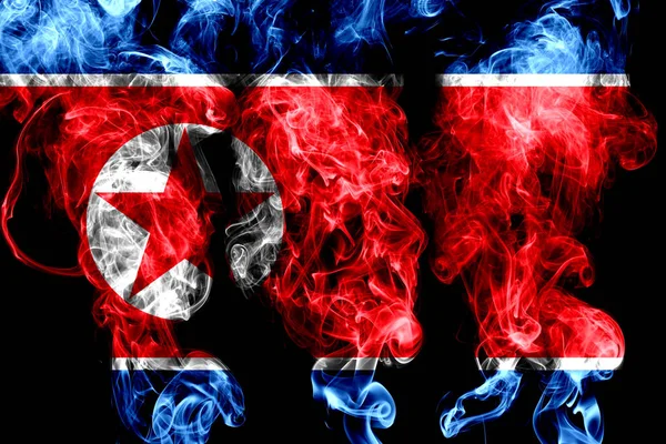 National flag of North Korea made from colored smoke isolated on black background
