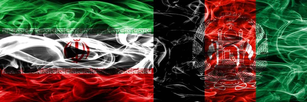 伊朗与阿富汗的烟雾旗并排放置 伊朗和阿富汗的厚颜色的丝质烟雾旗 — 图库照片
