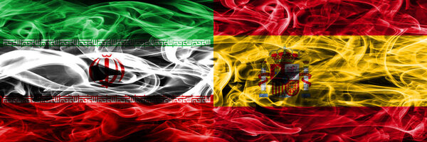 Iran vs Spain smoke flags placed side by side. Thick colored silky smoke flags of iranian and Spain