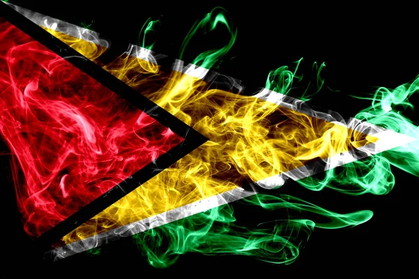 ガイアナの国旗は 黒の背景に分離された色の煙から作られました 抽象的な絹のような波の背景 — ストック写真