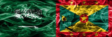 Suudi Arabistan rakip Grenada duman bayrakları yan yana yerleştirilmiş. Suudi Arabistan ve Grenada ipeksi duman bayrakları renkli kalın