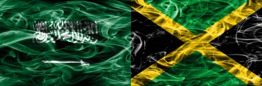 Suudi Arabistan rakip Jamaika duman bayrakları yan yana yerleştirilmiş. Suudi Arabistan ve Jamaika ipeksi duman bayrakları renkli kalın