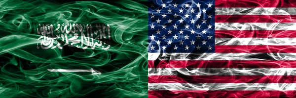 Saudi Arabia vs United States of America smoke flags placed side by side. Thick colored silky smoke flags of Saudi Arabia and United States of America