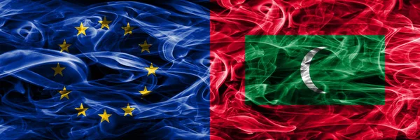 Europe Union and Maldives colorful concept smoke flags placed side by side