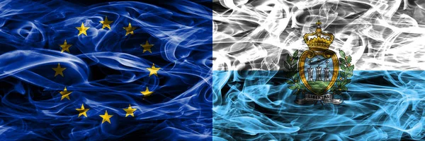 Europe Union and San Marino colorful concept smoke flags placed side by side