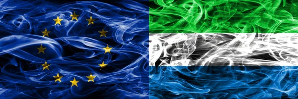 Europe Union and Sierra Leone colorful concept smoke flags placed side by side