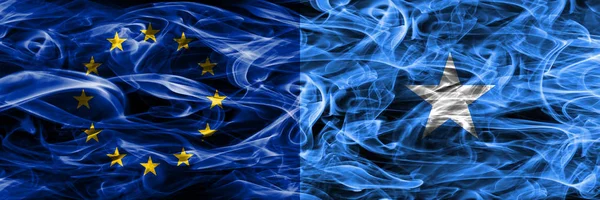 Europe Union and Somalia colorful concept smoke flags placed side by side