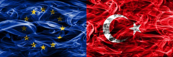 Europe Union and Turkey colorful concept smoke flags placed side by side