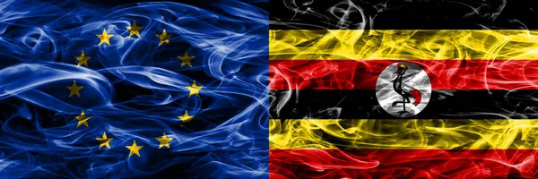 Europe Union and Uganda colorful concept smoke flags placed side by side