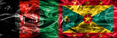 Afganistan vs Grenada duman bayrakları yan yana yerleştirilmiş. Afgan ve Grenada ipeksi duman bayrakları renkli kalın