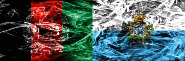 Afganistan vs San Marino duman bayrakları yan yana yerleştirilmiş. Afgan ve San Marino ipeksi duman bayrakları renkli kalın