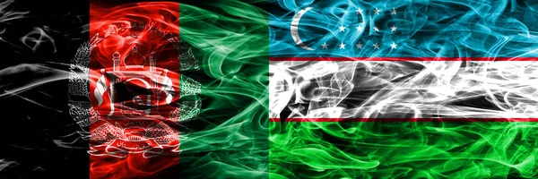 阿富汗 乌兹别克斯坦烟旗并排放置 阿富汗和乌兹别克斯坦厚颜色的丝质烟雾旗 — 图库照片