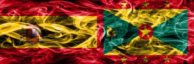 İspanya vs Grenada duman bayrakları yan yana yerleştirilmiş. İspanyolca ve Grenada ipeksi duman bayrakları renkli kalın
