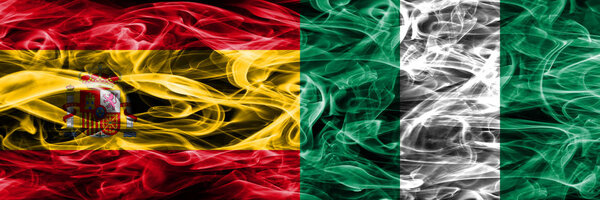 Spain vs Nigeria smoke flags placed side by side. Thick colored silky smoke flags of Spanish and Nigeria