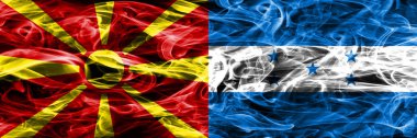 Makedonya vs Honduras renkli kavramı duman bayrakları yan yana yerleştirilmiş