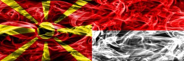 Makedonya vs Endonezya renkli kavramı duman bayrakları yan yana yerleştirilmiş