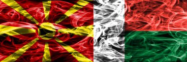 Makedonya vs Madagaskar renkli kavramı duman bayrakları yan yana yerleştirilmiş