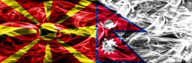 Makedonya vs Nepal renkli kavramı duman bayrakları yan yana yerleştirilmiş