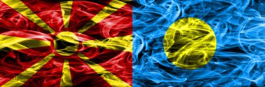 Makedonya vs Palau Renkli kavramı duman bayrakları yan yana yerleştirilmiş