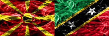 Makedonya vs Saint Kitts ve Nevis renkli kavramı duman bayrakları yan yana yerleştirilmiş