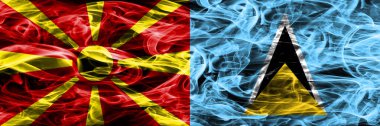 Makedonya vs Saint Lucia renkli kavramı duman bayrakları yan yana yerleştirilmiş