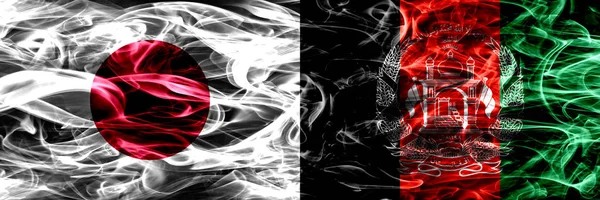 Япония Против Афганистана Афганские Дымовые Флаги Размещенные Бок Бок — стоковое фото