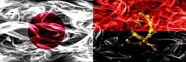 Япония Против Анголы Анголы Флаги Дыма Помещены Бок Бок — стоковое фото