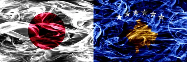 Япония Косово Сербия Дым Флаги Помещены Бок Бок — стоковое фото
