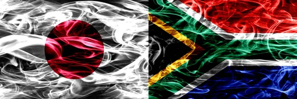 Япония Против Юар Африканские Дымовые Флаги Размещенные Бок Бок — стоковое фото