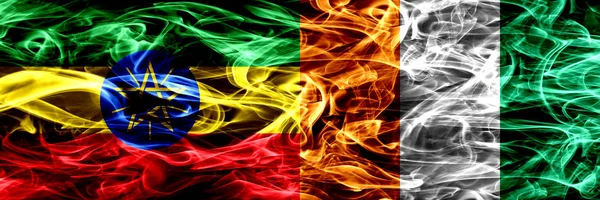 Drapeaux Fumigènes Colorés Ethiopie Côte Ivoire Placés Côte Côte — Photo