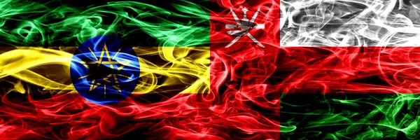 Etiyopya vs Umman Umman renkli bayrakları yan yana yerleştirilmiş duman