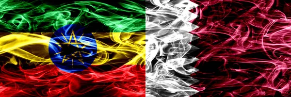 Etiyopya vs Katar, Katar renkli bayrakları yan yana yerleştirilmiş duman