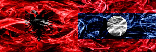 Албанія Проти Лаос Дим Прапори Розміщені Поруч Товста Кольорові Шовковистою — стокове фото