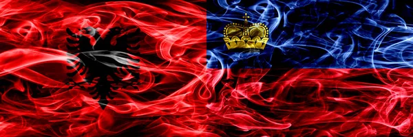 Albânia Liechtenstein Bandeiras Fumaça Das Chalupas São Colocadas Lado Lado — Fotografia de Stock