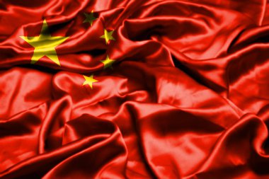 Çin bayrağı rüzgarda dalgalanıyor.