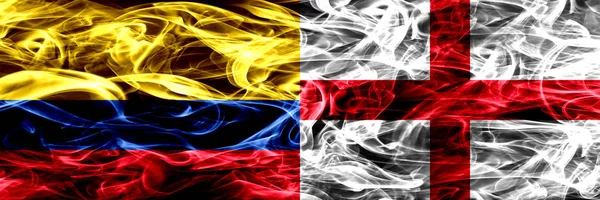 Colombia vs England, English smoke flags placed side by side. Thick colored silky smoke flags of Colombian and England, English