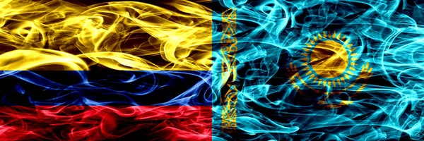 Colombia vs Kazakhstan, Kazakhstani smoke flags placed side by side. Thick colored silky smoke flags of Colombian and Kazakhstan, Kazakhstani