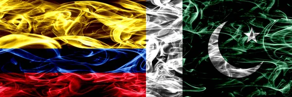 Colombia vs Pakistan, Pakistani smoke flags placed side by side. Thick colored silky smoke flags of Colombian and Pakistan, Pakistani