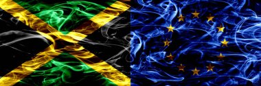 Jamaika vs Avrupa Birliği, AB bayrakları yan yana yerleştirilmiş duman. Jamaika ve Avrupa Birliği, AB ipeksi duman bayrakları renkli kalın