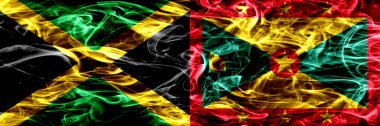 Jamaika vs Grenada duman bayrakları yan yana yerleştirilmiş. Jamaika ve Grenada ipeksi duman bayrakları renkli kalın