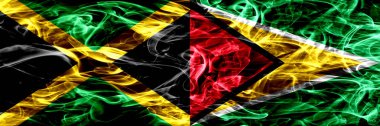 Jamaika vs Guyana, Guyanalı bayrakları yan yana yerleştirilmiş duman. Kalın ipeksi duman bayrakları Jamaika ve Guyana, Guyanalı renkli